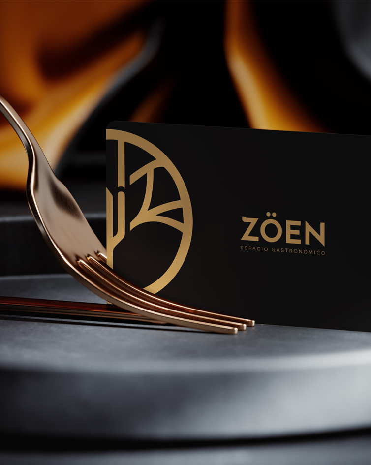 ZOEN, espacio gastronómico, se representa un tenedor cogiendo una tarjeta con el logo del nombre, muy elegante.